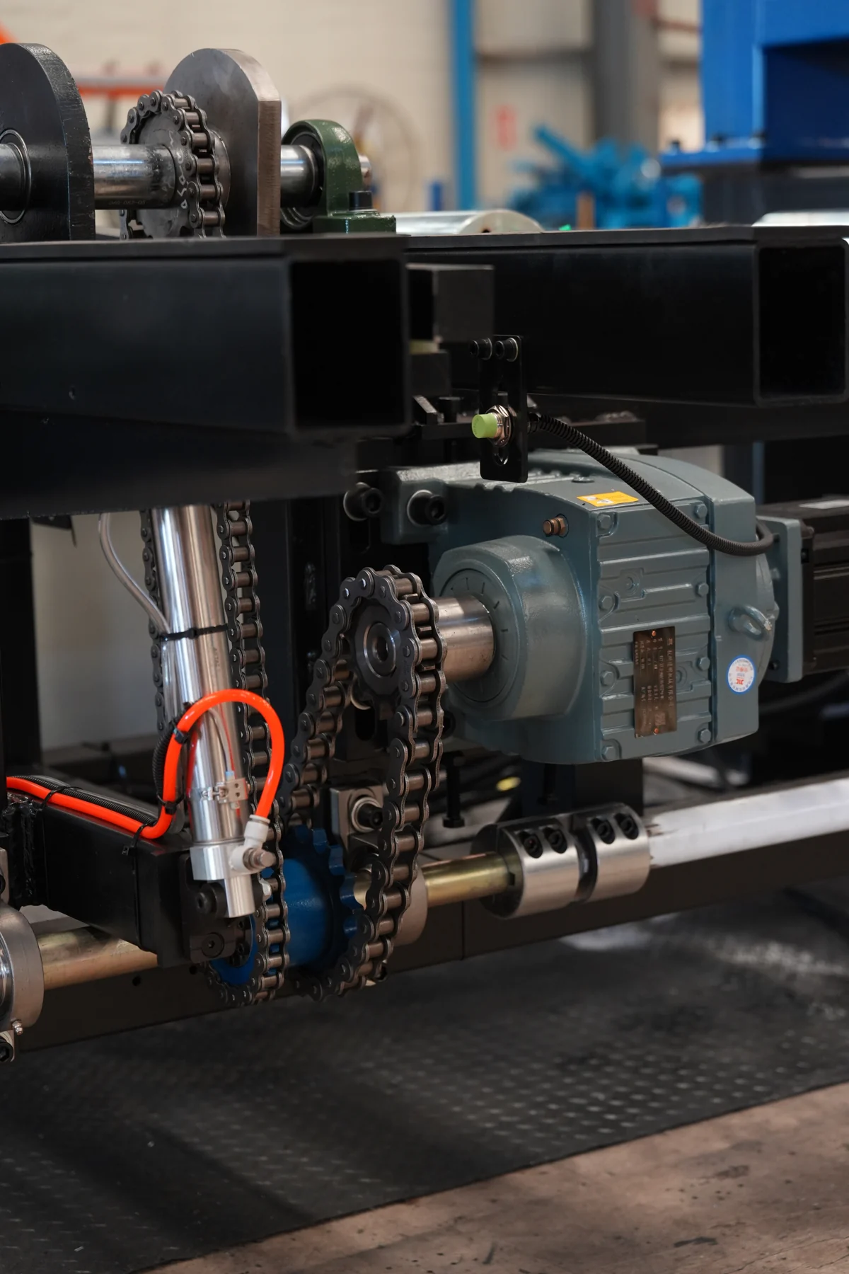 Motor, chain transmission and shaft drive components on roll forming equipment
