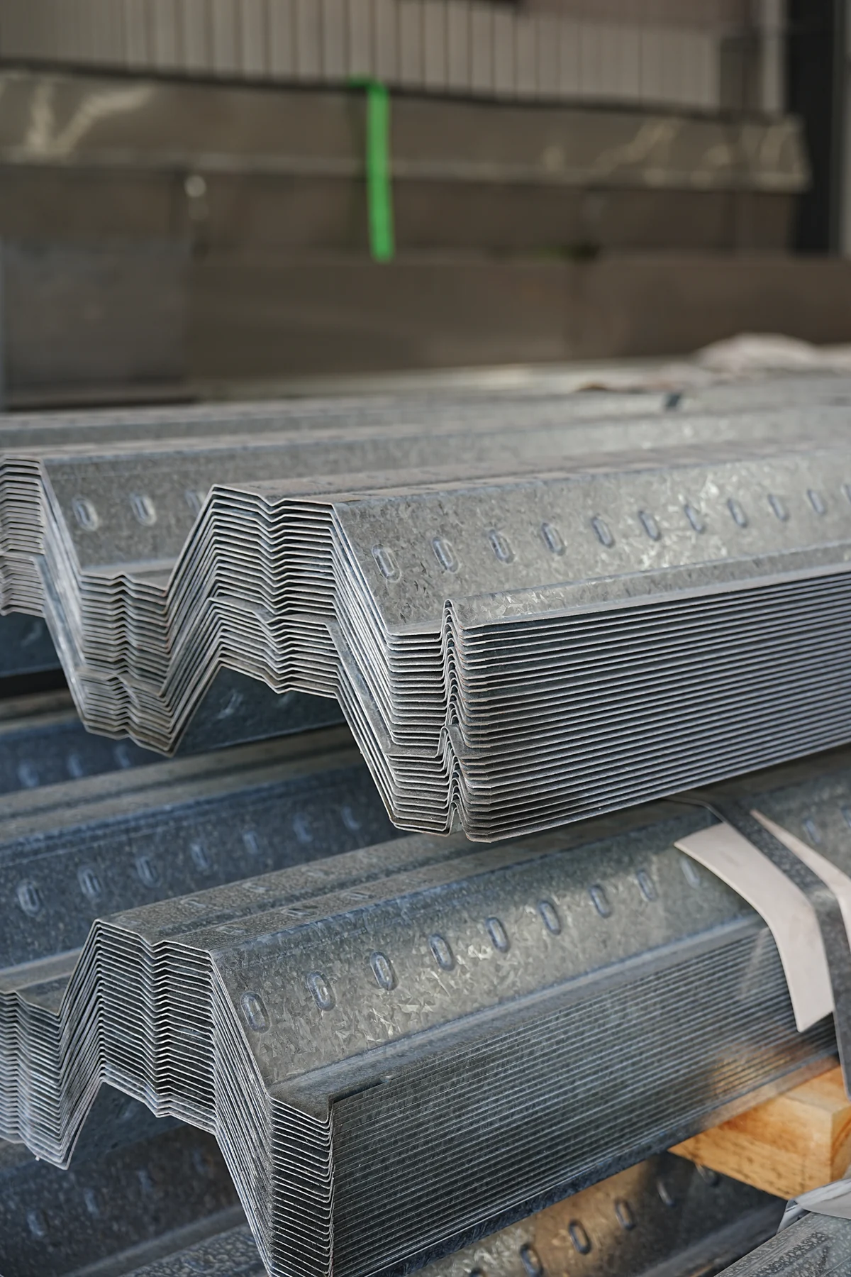 Stacked roll-formed profile samples retained for factory acceptance review