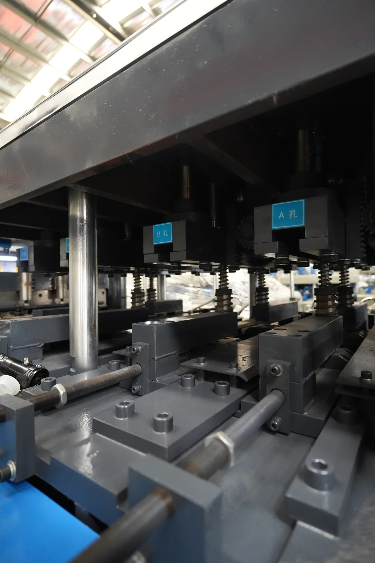 Numbered roll forming stations and adjustment points visible along a forming line