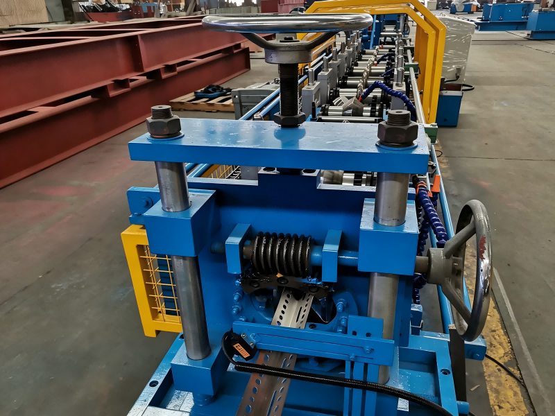 Perforated L-angle trim emerging from a roll forming line, reference workshop photo