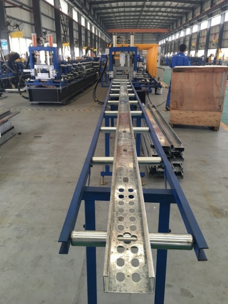 Punched C-section on support rollers at HC-300L workshop line