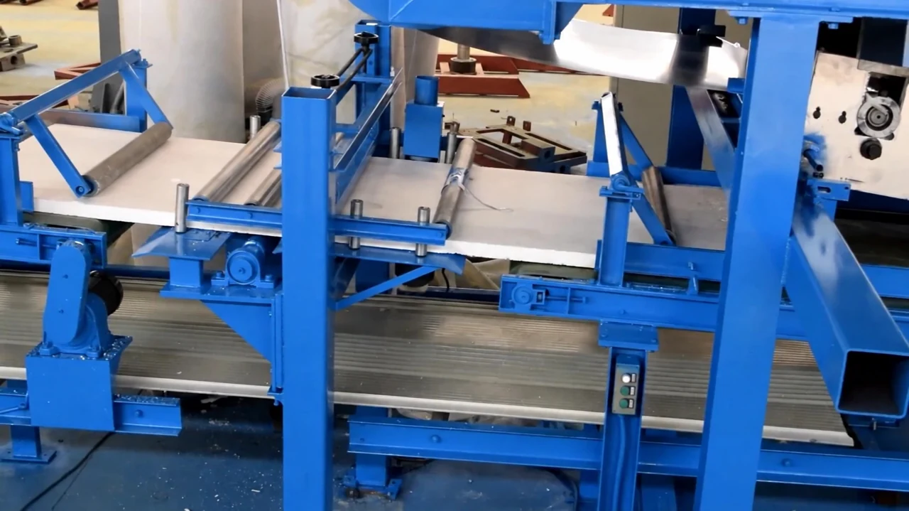 Blue frame and roller conveyor with a white core slab in our Xiamen production base's published XPS/EPS line video reference